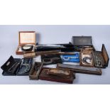 An assortment of scientific instruments, including a cable tensiometer, a tripod, mixed clamps,
