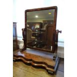 A Victorian mahogany swing frame toilet mirror, on serpentine plateau base, 23" wide