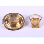A 9ct gold ring set citrine, ring size O, and a similar yellow metal mounted citrine brooch