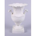 An 18th century creamware urn-shaped vase with peacock head handles, 7" high (small chips)