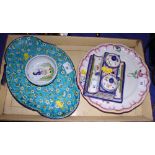 A Quimper ink stand, a nut dish, a floral decorated plate and a lobed dish