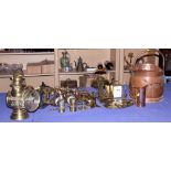 A copper coal scuttle, a brass kettle, a motorcar lamp (damages), various horse brasses, trays and