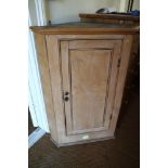 A stripped pine corner hanging cupboard enclosed panel door, 28" wide