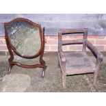 An early 20th century mahogany shield-shaped toilet mirror, on splay supports, and a child's chair