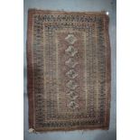 A Tekke Bokhara rug with seven geometric guls and multi-bordered in traditional shades, 66" x 48"