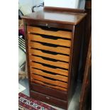 An Abbess mahogany tambour front stationery cabinet, fitted nine trays