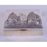 An early 20th century Chinese silver cigarette box, decorated to the lid with galleons, 5" wide