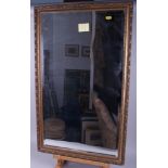 A rectangular bevelled edge wall mirror in gilt frame, 29" x 17", and an oval gilt frame wall