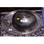 A silver plated meat dome, an oval gallery tray and a pie dish