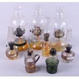 Eight early 20th century oil lamps