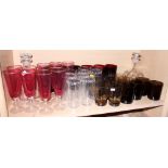 Eight cut glass sundae dishes, eleven cranberry glass champagne flutes and various other drinking
