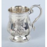 A silver christening mug with embossed floral decoration, Birmingham 1884, 1.5oz troy approx