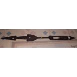 A Polynesian carved wooden paddle, 54" long