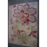 A contemporary Sanderson rug with floral decoration on a cream ground, 96" x 68" approx