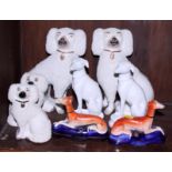 Two pairs of 19th century Staffordshire dogs, 8" x 4 3/4" high, a pair of greyhound ink wells, 4"