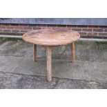 A 19th century waxed pine low cricket table, 26" dia