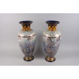 A pair of Doulton Slaters Patent vases with incised foliate decoration, 18 1/2" high