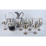 A cut glass claret jug of Rococo design with silver plated mount, a silver plated hot water jug with