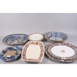 Five pottery meat dishes, various, a similar oval bowl and two plates
