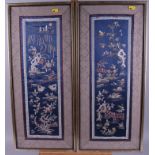 A pair of Chinese embroideries, decorated with trees and birds, in gilt frames, and another