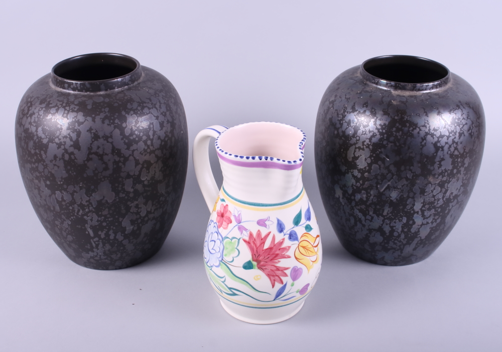 A pair of Poole pottery black lustre decorated baluster vases, 9" high, and a 1950s floral decorated