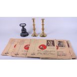 A pair of brass candlesticks, an iron doorstop and an assortment of 78rpm records, including Herbert