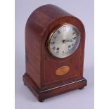 An Edwardian mahogany and inlaid arch top mantle clock with silvered dial and Roman numerals, 11"