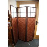 An Edwardian three-fold screen, the upper section fitted glazed panels over crimson brocade, 54"