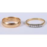 An 18ct gold wedding band and an 18ct gold dress ring set seven diamonds, both rings size O/P, 5.