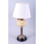 A brass and milk glass oil table lamp with reeded column (now converted to electricity)