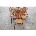 A set of six Stewart Linford Windsor splat back dining chairs with crinoline stretchers