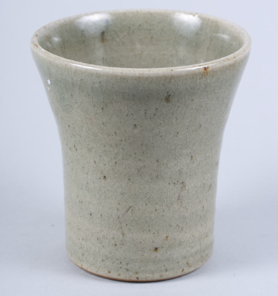 A St Ives studio pottery flared beaker, in a celadon glaze, 3 3/4" high