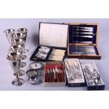 Six silver plated goblets, an assortment of boxed and loose cutlery, and other items