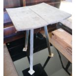 An antique rustic green painted plank top table, on three splay supports, top 18" x 18"