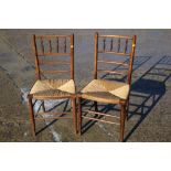 A pair of William Morris design Sussex side chairs