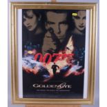 A James Bond "Golden Eye" poster, in gilt frame, and a "Tom and Jerry" print