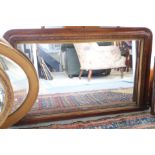 A walnut and inlaid over mantel mirror, a strut mirror and a swing frame toilet mirror, on bobbin