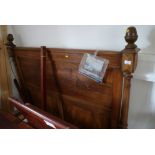A late 19th century pine polished as walnut double bed frame with carved decoration