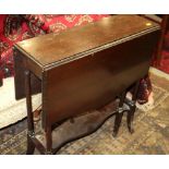 An Edwardian mahogany Sutherland tea table