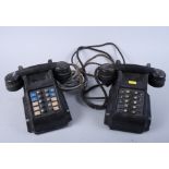 A pair of black Bakelite service telephones