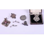 A white metal and paste set lapel clip with scent or poison phial in the hinge, Prov Pat No 29739, a