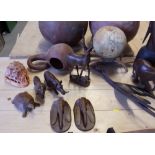A selection of carved treen animals, a carved bust, carved weapons, terracotta vases and other