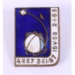 An enamelled brass pin badge, relating to the various Sputnik satellites