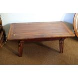 An Ecuadorian hardwood low coffee table, 47" wide