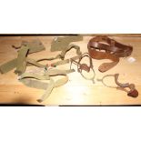 A WWII canvas pistol holster, a leather gun belt and various other related items