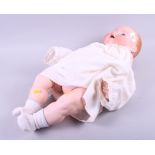 An Armand Marseilles bebe doll with porcelain head, 351/10k, composition body and limbs, 24" high