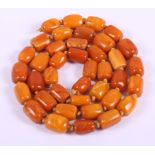 A string of butterscotch amber beads, 37" long, 112.5g