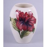 A Moorcroft "Hibiscus" pattern oviform vase, 5" high