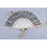 A 19th century Canton carved ivory brise fan decorated "thousand faces", sticks 11" long, in