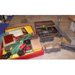 A Meccano clockwork motor, a selection of model train accessories, including carriages and other